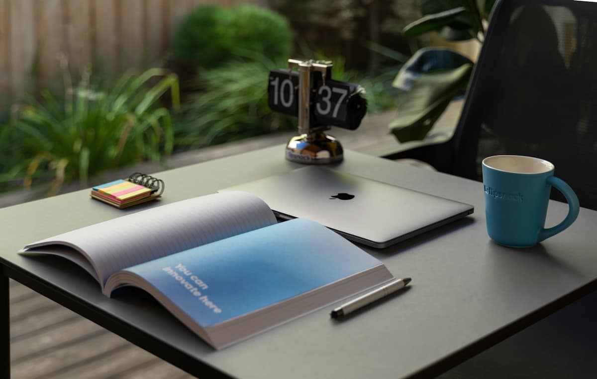 a book and a pen on a table