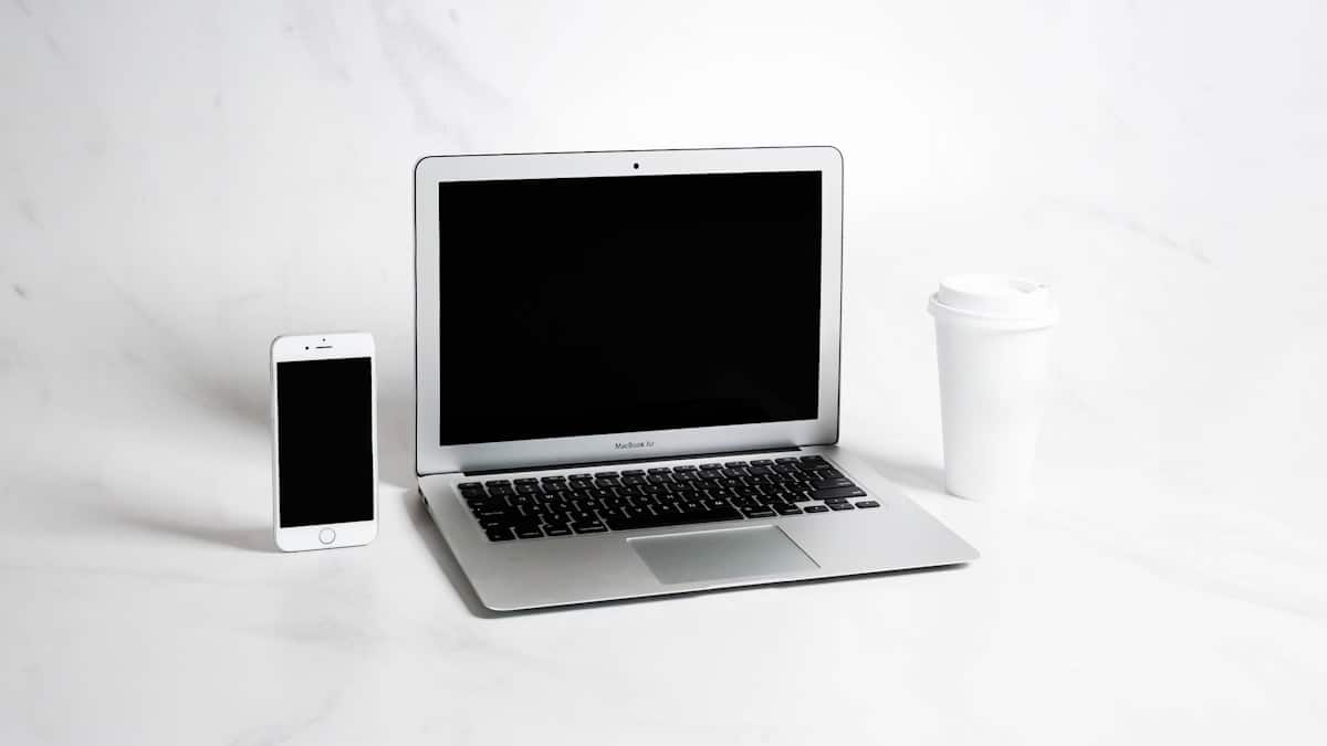 a laptop and a coffee cup