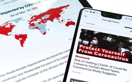 "iPhone 4 noir avec drapeau rouge et blanc, symbole de l'actualité sanitaire et sociale 2025"
